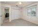 Bright bedroom with a window, closet, and carpeted flooring, offering a comfortable living space at 5423 Abagail Dr, Spring Hill, FL 34608
