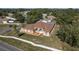 Attractive single-story home with well-maintained landscaping, complemented by palm trees and a driveway at 5423 Abagail Dr, Spring Hill, FL 34608