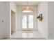Bright foyer with tile flooring, double doors, and arched window above, creating an inviting entrance at 5423 Abagail Dr, Spring Hill, FL 34608