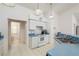 Kitchen features blue countertops, white cabinets and appliances, and views of the bathroom and dining room at 5423 Abagail Dr, Spring Hill, FL 34608