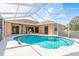 Beautiful screened-in pool and patio area with ample space for dining and lounging at 5423 Abagail Dr, Spring Hill, FL 34608