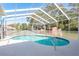Inviting private pool with a screened enclosure, providing a refreshing outdoor oasis at 5423 Abagail Dr, Spring Hill, FL 34608