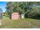 Outdoor storage shed in a well-maintained backyard, providing extra space for tools and equipment at 5423 Abagail Dr, Spring Hill, FL 34608