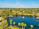 Aerial view of the community lake, showcasing the surrounding lush trees and park amenities at 5627 Ferguson Ct # 1303, New Port Richey, FL 34652