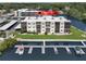 Waterfront condo building features boat docks, lush landscaping, and serene water views for tranquil living at 5627 Ferguson Ct # 1303, New Port Richey, FL 34652
