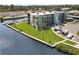 Condo building with waterfront access, well-maintained landscaping, and convenient parking at 5627 Ferguson Ct # 1303, New Port Richey, FL 34652
