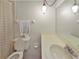 Bathroom featuring a toilet, a towel, a shower curtain, and a sink at 5627 Ferguson Ct # 1303, New Port Richey, FL 34652