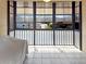 Enclosed lanai with lots of windows and tile floor with a view of a residential street at 5627 Ferguson Ct # 1303, New Port Richey, FL 34652