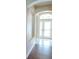 Entryway featuring an arched doorway and a view of the front doors at 5701 Brackenwood Dr, Spring Hill, FL 34609