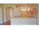 Bright, open kitchen layout with wooden cabinetry and a breakfast bar at 5701 Brackenwood Dr, Spring Hill, FL 34609