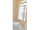 Large window with grids providing abundant natural light into the room at 5701 Brackenwood Dr, Spring Hill, FL 34609