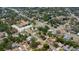 Expansive aerial view of a residential neighborhood showcasing tree-lined streets and well-maintained homes at 6172 Raleigh St, Spring Hill, FL 34606