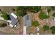 Aerial view of the property showcasing the home's layout, surrounding lot, and proximity to the neighborhood at 6172 Raleigh St, Spring Hill, FL 34606