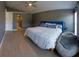 Spacious bedroom with neutral walls, wood-look tile floors, and natural light from multiple windows at 6172 Raleigh St, Spring Hill, FL 34606