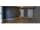 Cozy bedroom with spacious closet, ceramic tile flooring, and neutral gray walls at 6172 Raleigh St, Spring Hill, FL 34606