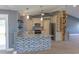 Modern kitchen featuring stainless steel appliances, tiled backsplash, counter seating and modern lighting fixtures at 6172 Raleigh St, Spring Hill, FL 34606