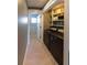 Convenient laundry area with modern washer and dryer, and built-in shelving for supplies at 6172 Raleigh St, Spring Hill, FL 34606