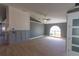 Inviting living room with light ceramic tile, ceiling fan, large window, and gray and white color scheme at 6172 Raleigh St, Spring Hill, FL 34606