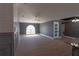 Spacious living room with neutral colors, elegant trim, light ceramic tile, and a ceiling fan at 6172 Raleigh St, Spring Hill, FL 34606
