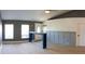 Bright living space with wainscoting, wood-look flooring, and a modern console table at 6172 Raleigh St, Spring Hill, FL 34606