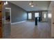 Inviting living space with wood-look floors, recessed lighting, and contemporary accents at 6172 Raleigh St, Spring Hill, FL 34606