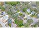 An aerial shot over the homes in a tree-covered residential neighborhood at 6315 Shane Ln, New Port Richey, FL 34653