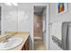 Well lit bathroom with large mirror, single sink vanity, and shower at 6315 Shane Ln, New Port Richey, FL 34653