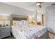 Bright bedroom features floral bedding, gray walls, and ensuite bathroom at 6315 Shane Ln, New Port Richey, FL 34653