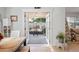 Cozy dining area featuring French doors leading to a screened lanai and outdoor space at 6315 Shane Ln, New Port Richey, FL 34653
