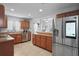 Kitchen featuring stainless steel appliances, wood cabinets, and tile flooring at 6315 Shane Ln, New Port Richey, FL 34653