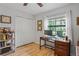 Bright home office with hardwood floors, natural light, and closet at 6315 Shane Ln, New Port Richey, FL 34653