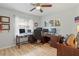 Spacious home office with multiple monitors and hardwood floors at 6315 Shane Ln, New Port Richey, FL 34653
