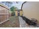 Side yard features a stone path and landscaping at 6315 Shane Ln, New Port Richey, FL 34653