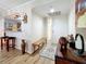 Welcoming entryway with wood flooring, a bench seat, and stylish decor leading to the kitchen at 700 Starkey Rd # 622, Largo, FL 33771
