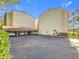 Exterior view of condo buildings with covered parking, landscaping, and well-maintained grounds at 700 Starkey Rd # 622, Largo, FL 33771