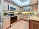 Charming kitchen with granite countertops, stainless steel appliances, and ample cabinet space at 700 Starkey Rd # 622, Largo, FL 33771