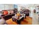 Comfortable living room with plush leather furniture, a stylish coffee table, and an open floor plan at 700 Starkey Rd # 622, Largo, FL 33771