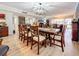 Spacious dining and living areas featuring modern decor and wood flooring under a modern light fixture at 700 Starkey Rd # 622, Largo, FL 33771
