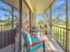 Enclosed patio with a table and chairs provides a relaxing outdoor space at 700 Starkey Rd # 622, Largo, FL 33771