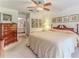 Bedroom featuring a wooden bed frame and furniture, with decor art on the walls at 7392 Willow Brook Dr, Spring Hill, FL 34606