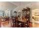 Inviting dining room with hardwood floors, chandelier, and access to additional living space at 7392 Willow Brook Dr, Spring Hill, FL 34606