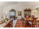Open-concept dining room with hardwood floors, chandelier lighting, and ample room for entertaining at 7392 Willow Brook Dr, Spring Hill, FL 34606