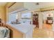 Spacious kitchen with white countertops, cabinets, and views into dining and living areas at 7392 Willow Brook Dr, Spring Hill, FL 34606