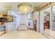 Open kitchen showing a breakfast nook and views into adjacent living and dining spaces at 7392 Willow Brook Dr, Spring Hill, FL 34606