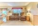 Bright living room featuring two comfortable recliner chairs, side tables and natural lighting at 7392 Willow Brook Dr, Spring Hill, FL 34606