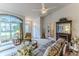 Comfortable living room with a fireplace, stylish decor, and ample seating at 7392 Willow Brook Dr, Spring Hill, FL 34606