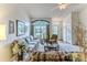 Open-concept living room with a view of the front entrance and large windows at 7392 Willow Brook Dr, Spring Hill, FL 34606