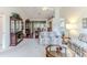 Inviting living room featuring hardwood floors and neutral tones flowing into the adjacent dining room at 7392 Willow Brook Dr, Spring Hill, FL 34606