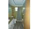 Bathroom with vanity, toilet, shower/bath with shower curtain and yellow ceramic tile at 7421 Fairfax Dr, Port Richey, FL 34668