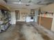 Garage featuring laundry equipment, and storage shelves at 7421 Fairfax Dr, Port Richey, FL 34668